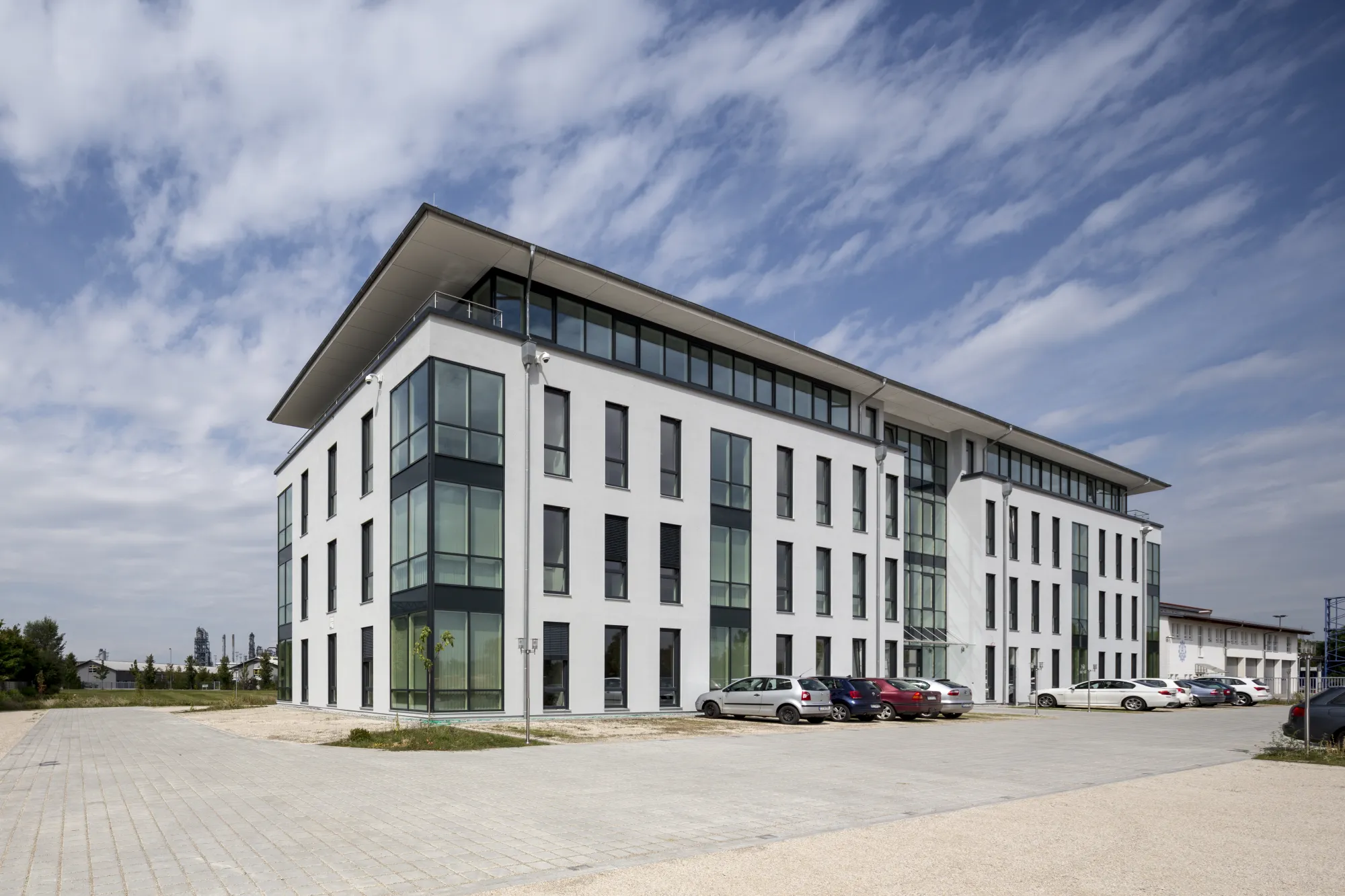 Four-storey office building with a light facade