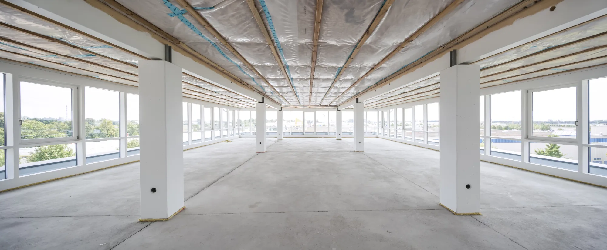 Open-plan office floor with continuous glazing